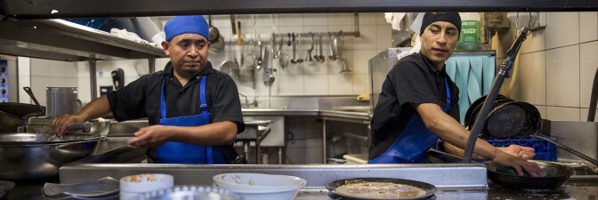Dishwashers Esteban Soc, left, and Joselino Aguilar, right, at work in the kitchen of Mexican restaurant Caracol in Houston, Texas. | Scott Dalton for The Washington Post via Getty Images