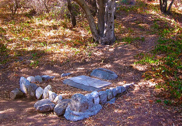 The triple headstones of the Rankin Children in Monrovia Canyon Parks. The headstones originally stood upright but were placed flat at a later time. | Photo: Daniel Medina