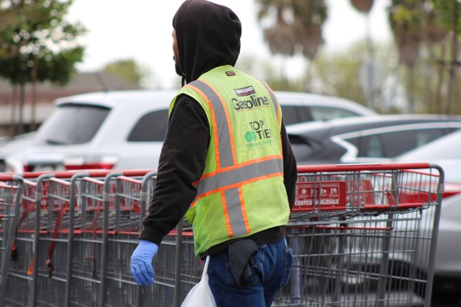 Costco worker wearing gloves during COVID-19 pandemic in parking lot | Karen Foshay