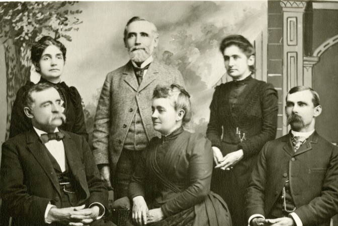 Lyman Stewart (standing, center) with his family