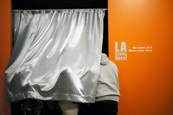 Students explore the 'LA Starts Here' exhibit at La Plaza de Cultura y Artes