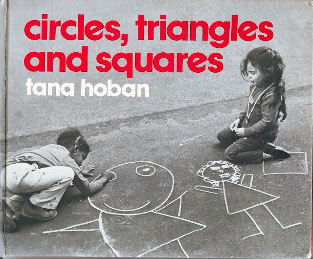 “Circles, Triangles and Squares” (Ages 2-4) by Tana Hoban book cover with girls drawing with chalk on a sidewalk