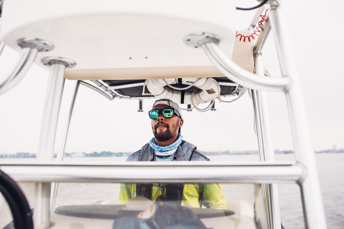 Captain Fred stands on his fishing boat.