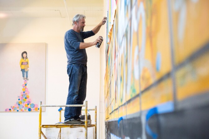Tobias Keene works on a large wall painting for an upcoming exhibition. | Magali Gauthier Santa Fe Art Colony