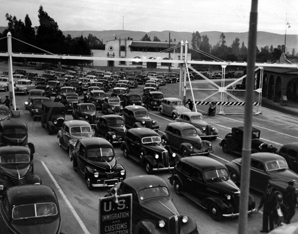 Cars returning to the U.S. from Mexico in 1941. The drivers and their passengers had apparently been attending the horse races at Agua Caliente. Photo from the Herald-Examiner Collection and courtesy the Los Angeles Public Library