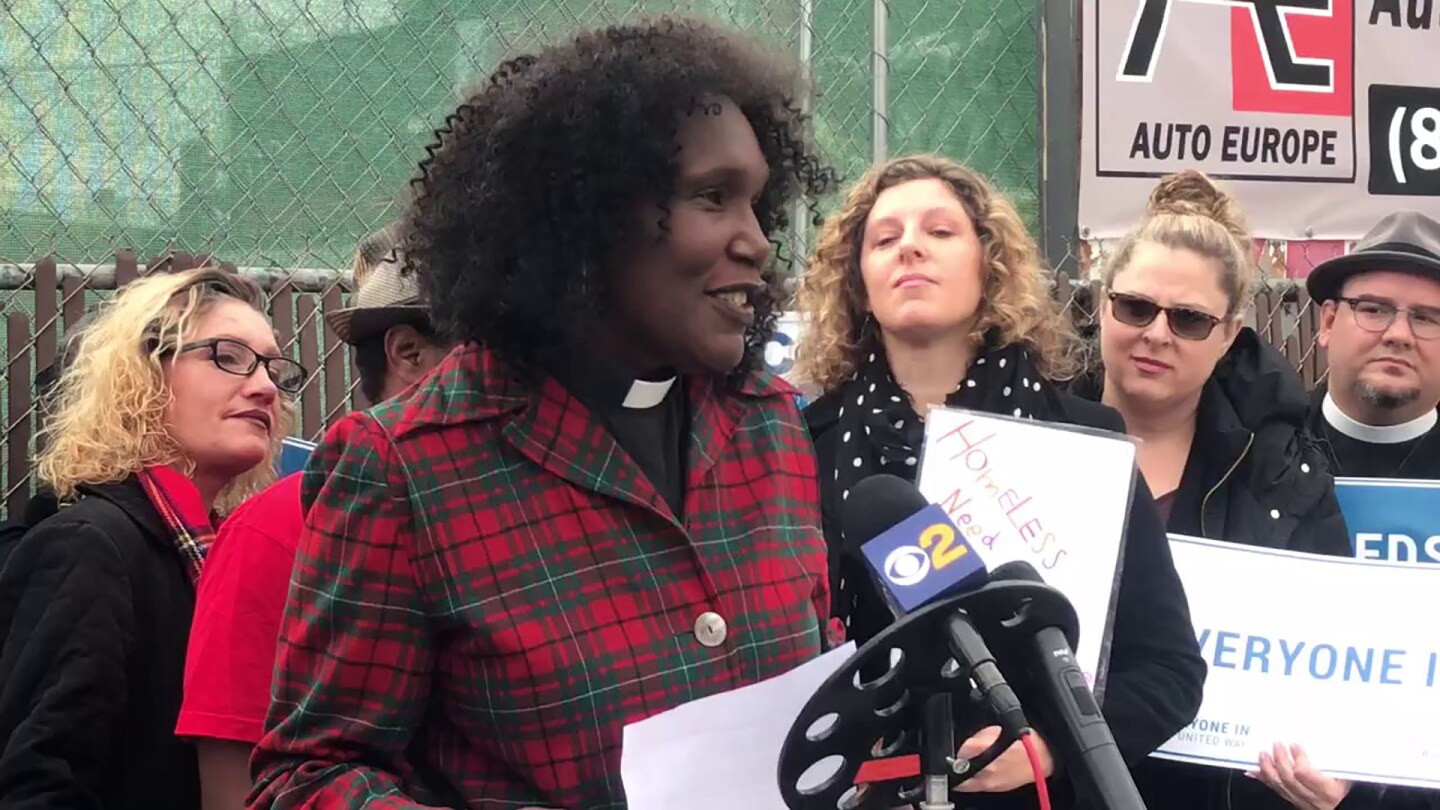 Pastor Kathy Huck speaks in front of a microphone. | Courtesy of Pastor Kathy Huck