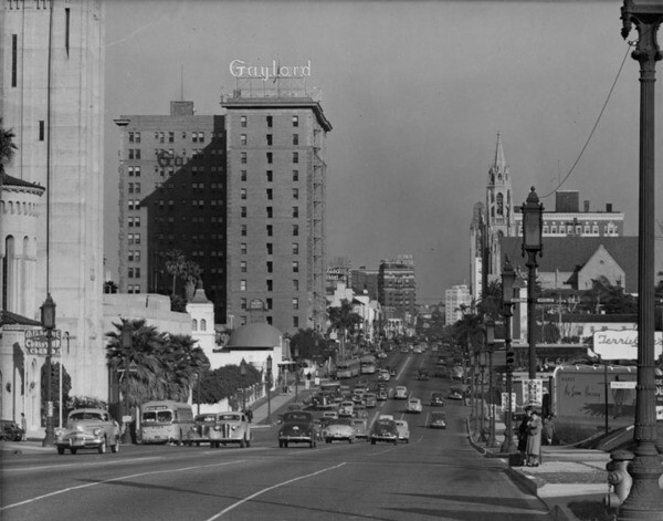 Wilshire Boulevard, looking downtown ca. 1940. The Brown Derby can be seen in the foreground of The Gaylord | Courtesy of the Los Angeles Public Library