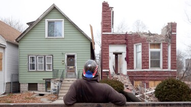 A house is demolished in the neighborhood featured in "The Area."