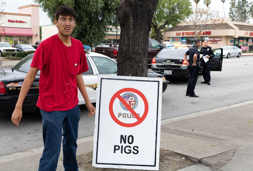 Omar Solorio with his work "No Pigs," 2017. | Angel Xotlanihua.