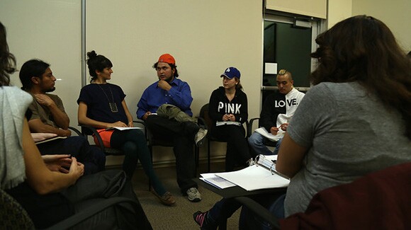 Individuals in dialogue between presentations during Flowers For Action, Seeds For Change event at CalState University Los Angeles, part of Chats About Change event 1/15/15. | Photo: Emily Lacy.