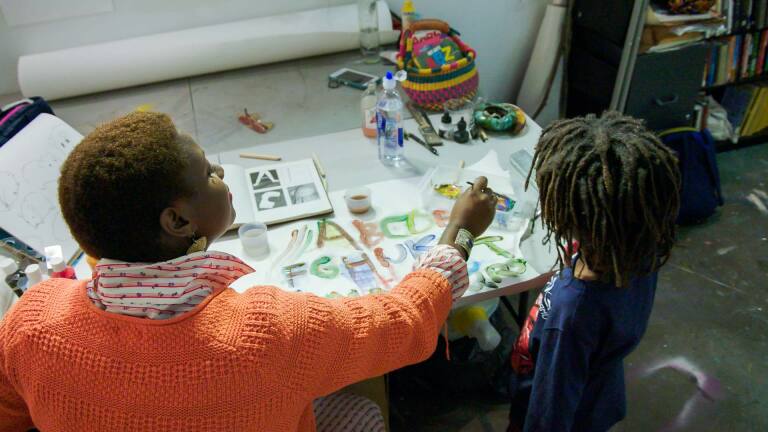 Artist Kenyatta A.C. Hinkle with her son, Johari | Still from KCET Artbound's "Artist and Mother" Mother AB s9