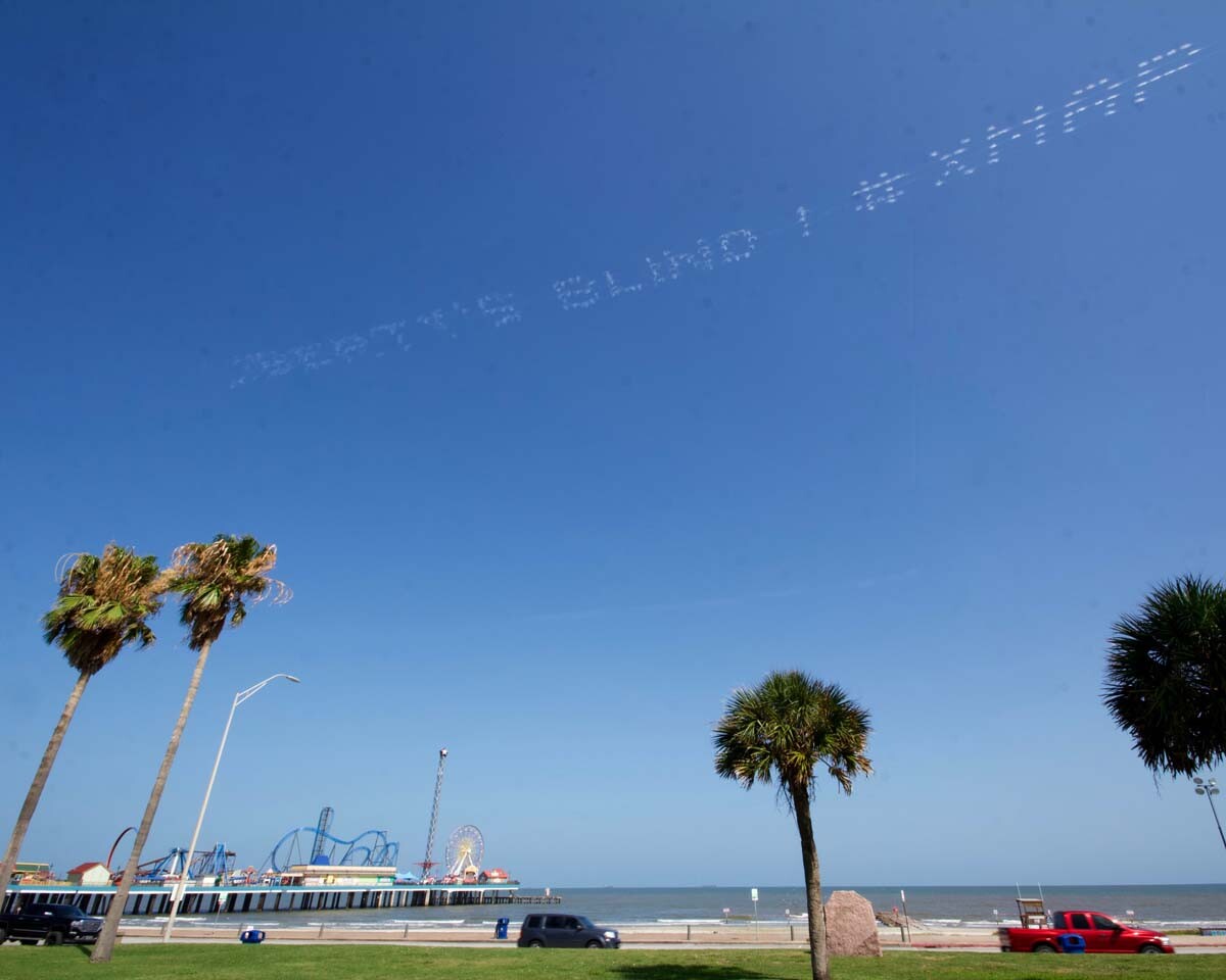 "LIBERTY'S BLIND #XMAP" written in in the sky, contributed by Robin Hemley over Galveston, Texas | Antha Adkins, In Plain Sight
