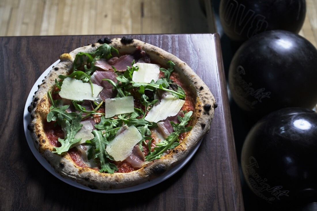 Crudo and Arugula pizza at the Highland Park Bowl