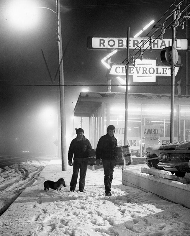 David and Bob Naranjo drag a toboggan down a Tujunga street after the snowstorm of 1962