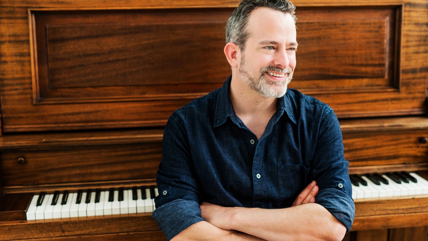 Composer Geoff Zanelli at the piano