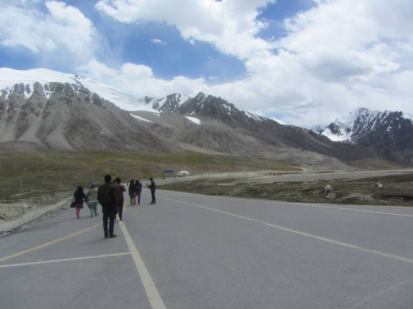ARCHIVE PHOTO: Visitors look at the mountains of Khunjerab National Park in Pakistan, August 19, 2017. | Thomson Reuters Foundation/Rina Saeed Khan