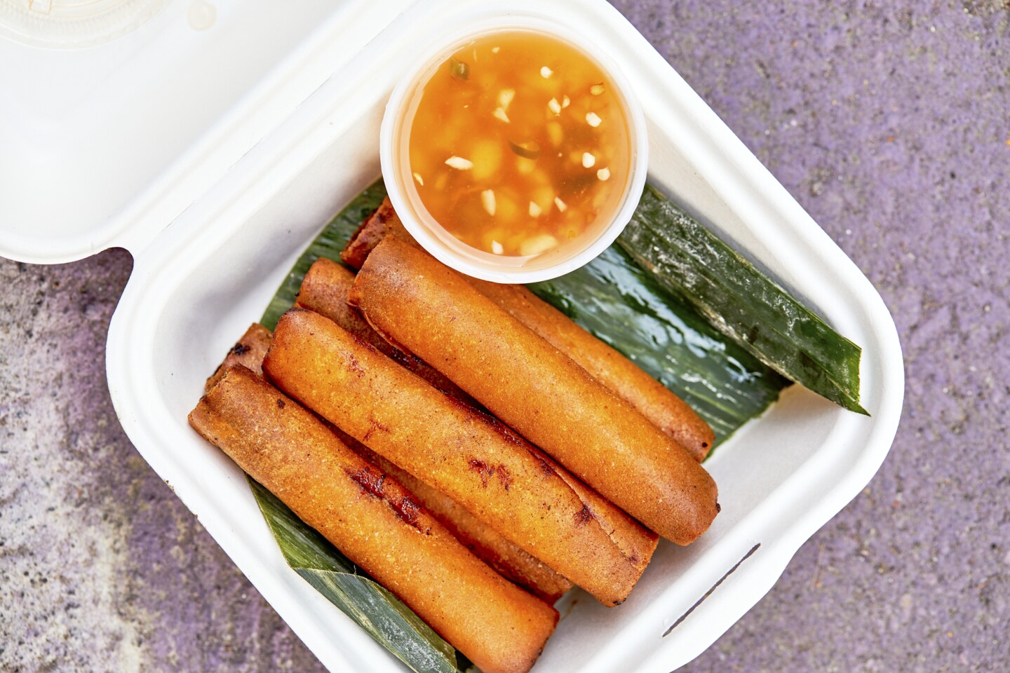 Longganisa lumpia, a deep-fried eggroll, from Mano Po.