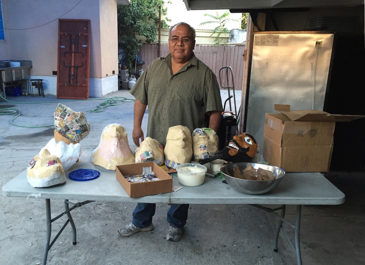 Ted Lazaro with Oaxacan masks