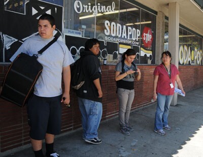 Richard, Raul and Brenda wait with Ms. Tam in front of Galco's