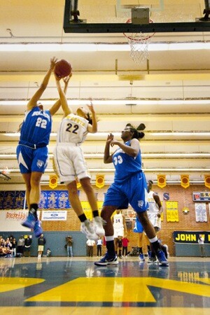 Simone DeCoud reaching for the rebound over 'the bigs' | Photograph by Douglas McCulloh