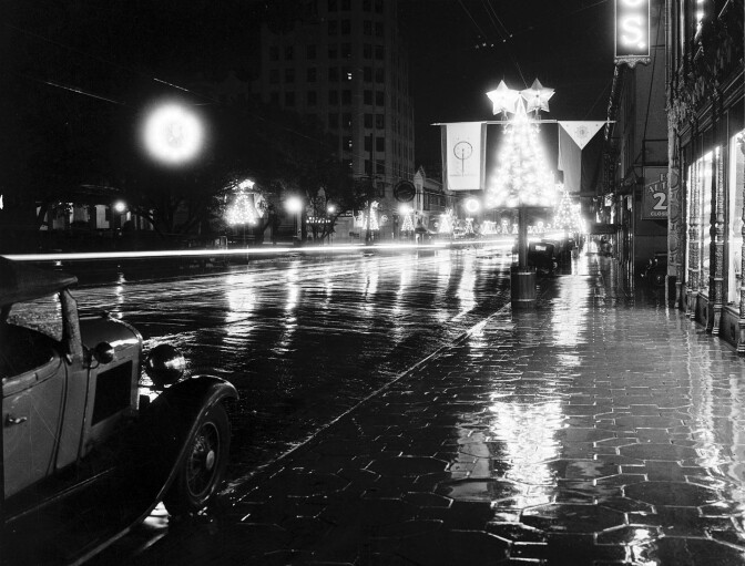 Circa 1935 view of a wet Hollywood Boulevard decorated for the holidays. Courtesy of the California Historical Society Collection, USC Libraries.
