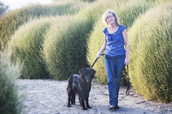 Susan Straight and her dog walks among tumbleweeds along the Santa Ana River in Riverside, CA. | Photo: Douglas McCulloh