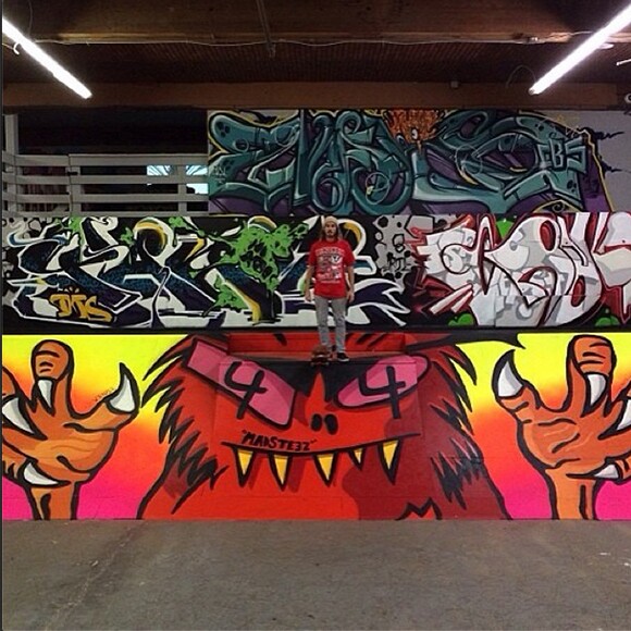 Madsteez standing on his new piece at Hurley Skate Park. Also pictured: new work by Yanoe, Craola, and Sramars.