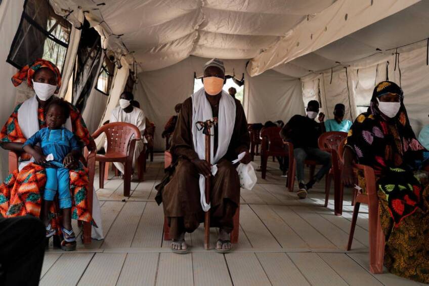 Local residents wait, inside a tent used as a waiting room, their turn for examination at the army field hospital, amid the outbreak of the coronavirus disease (COVID-19) in Touba, Senegal, May 1, 2020. Picture taken May 1, 2020. | REUTERS/Zohra Bensemra