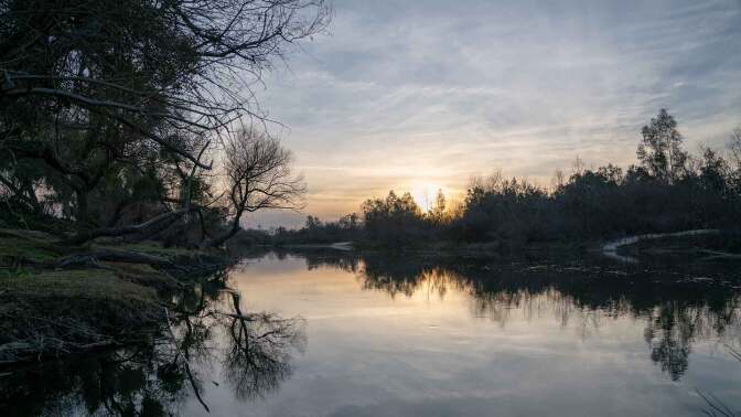 The sun setting on the San Joaquin River. | Carla Pineda