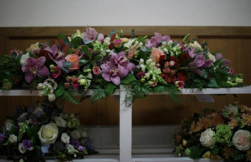 Funeral flowers are seen in the mortuary at Poppy's Funerals in Lambeth Cemetery, as the spread of the coronavirus disease (COVID-19) continues in London, Britain, April 30, 2020. Picture taken April 30. | REUTERS/Hannah McKay