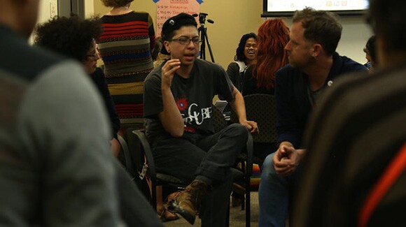 Individuals in dialogue between presentations during Flowers For Action, Seeds For Change event at CalState University Los Angeles, part of Chats About Change event 1/15/15. | Photo: Emily Lacy.