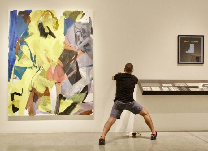 From left to right, Sarah Awad’s “Pairing 3”, 2020. Oil and vinyl on canvas 90 x 72 in. Marcel Duchamp’s signed 1959 “Self-Portrait in Profile,” seriograph. Framed Dimensions: 25 1/2 x 23 3/4 in. | Jordan Riefe