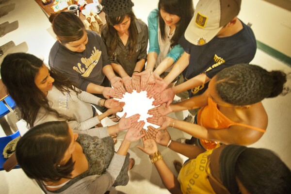 One group of students wrote two words that meant home -- brothers, music, junk food, friends -- on their palms. | Photo by Douglas McCulloh