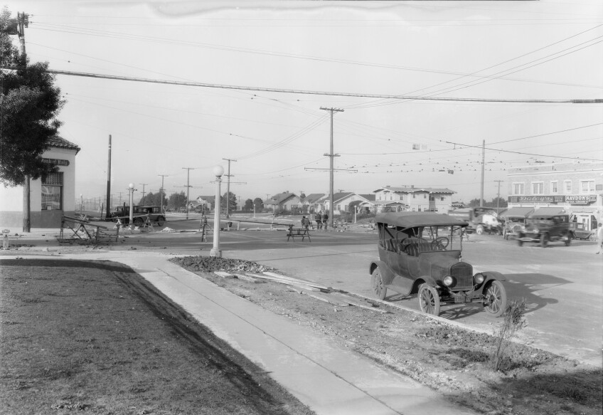 The sidewalk at West 54th Street and Angeles Mesa Drive, later called Crenshaw Boulevard, which shows old-fashioned cars.