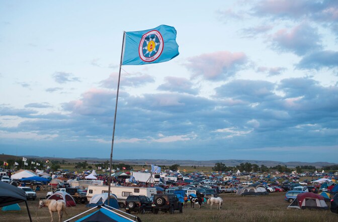 A Standing Rock Sioux flag flies over a protest encampment near Cannon Ball, North Dakota where members of the Standing Rock Sioux tribe and their supporters gathered to voice their opposition to the Dakota Access oil Pipeline (DAPL), September 3, 2016.