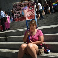 A woman at the 2015 International Women's Day march in L.A. | Mark Ralston/AFP via Getty Images