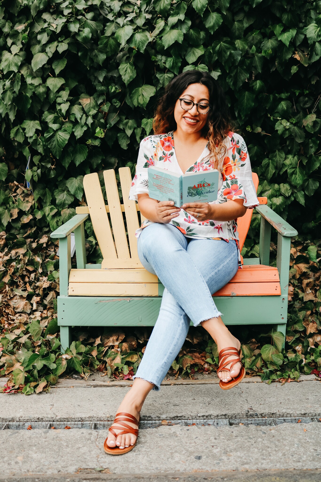 Author Maggie Carranza poses with her book "ABCs of El Salvador"