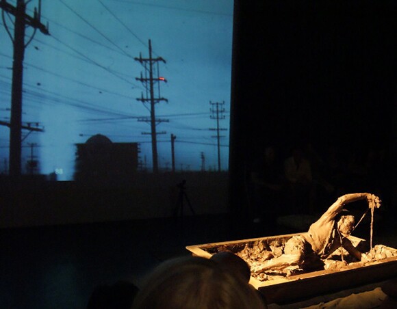 Mike Mollett performing in "Hold Your Mud, LA," a performance directed by Barbara T. Smith; Highways Performance Space, 2009. Photo: Van Don Jordan.