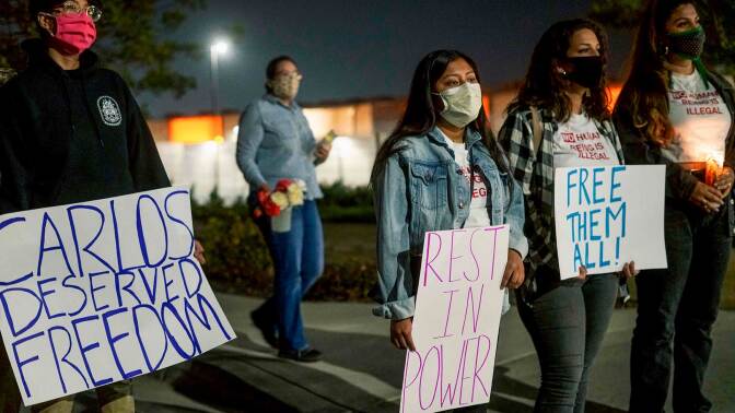 Protesters stand outside Otay Mesa Detention Center during a "Vigil for Carlos" rally on May 9, 2020 in Otay Mesa, California.