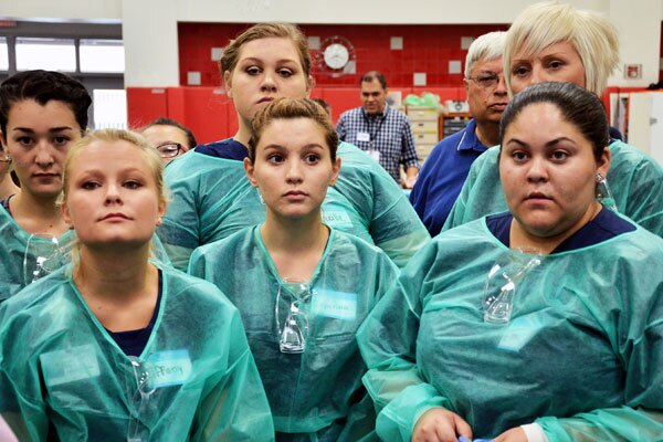 Volunteer dental and health care professionals stand at attention, ready for the day-long event. I Photo By: Ricardo Palavecino