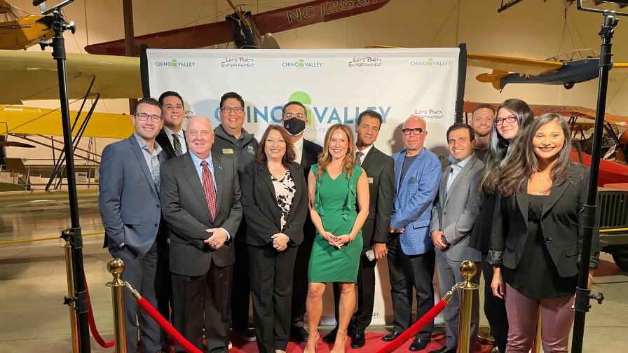 Melissa Demirci poses with members of the Chino Valley Chamber of Comm