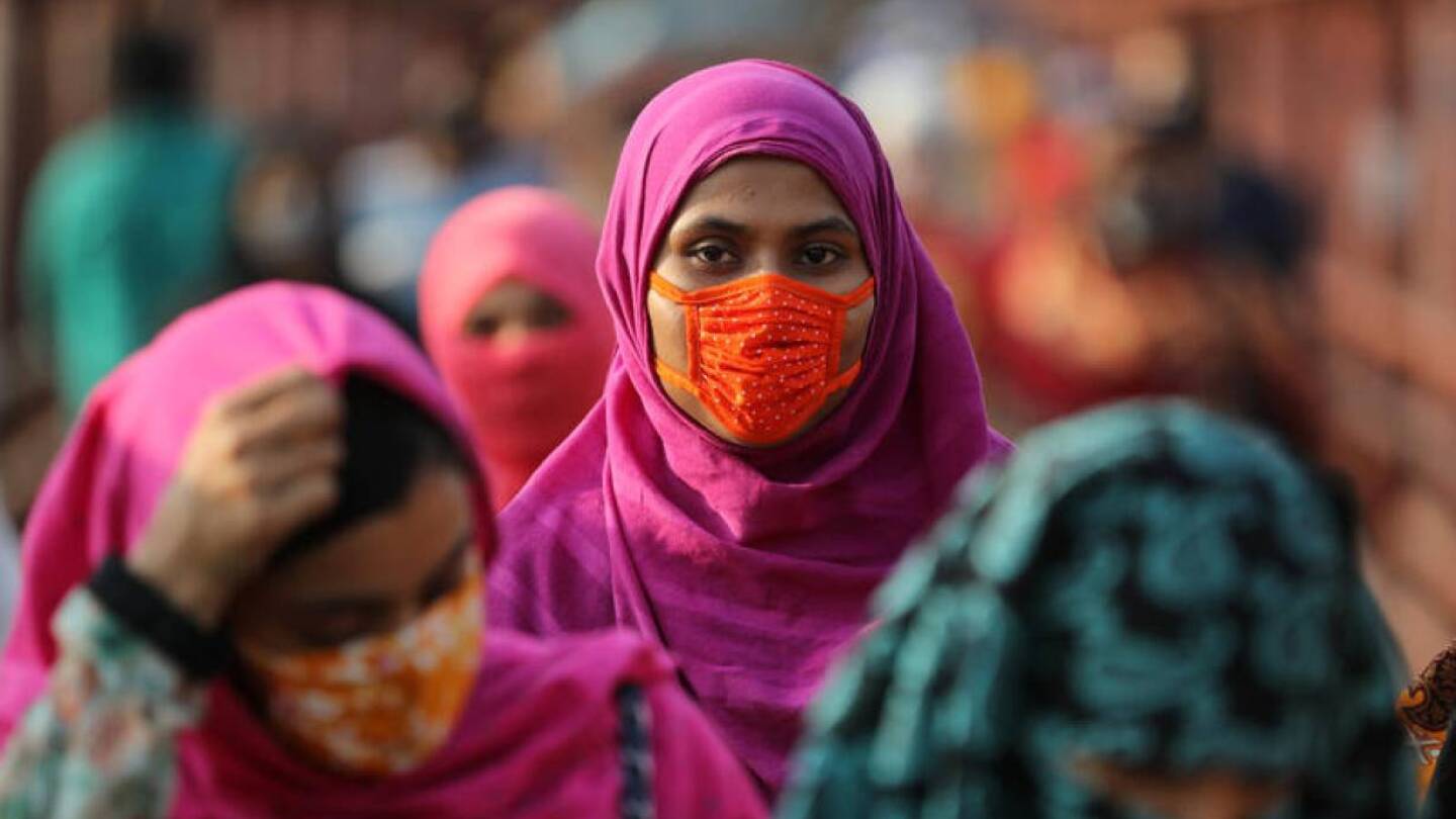 A garment worker wearing a protective mask returns from a workplace as factories reopened after the government has eased the restrictions amid concerns over the coronavirus disease (COVID-19) outbreak in Dhaka, Bangladesh, May 4, 2020. |REUTERS/Mohammad P