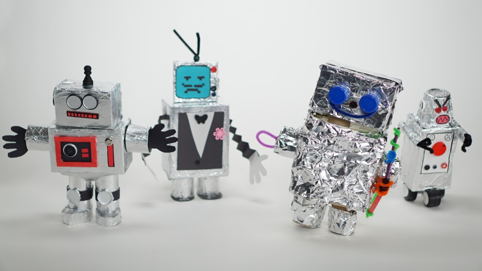 kids robot crafts made from boxes and aluminum foil with different faces and expressions