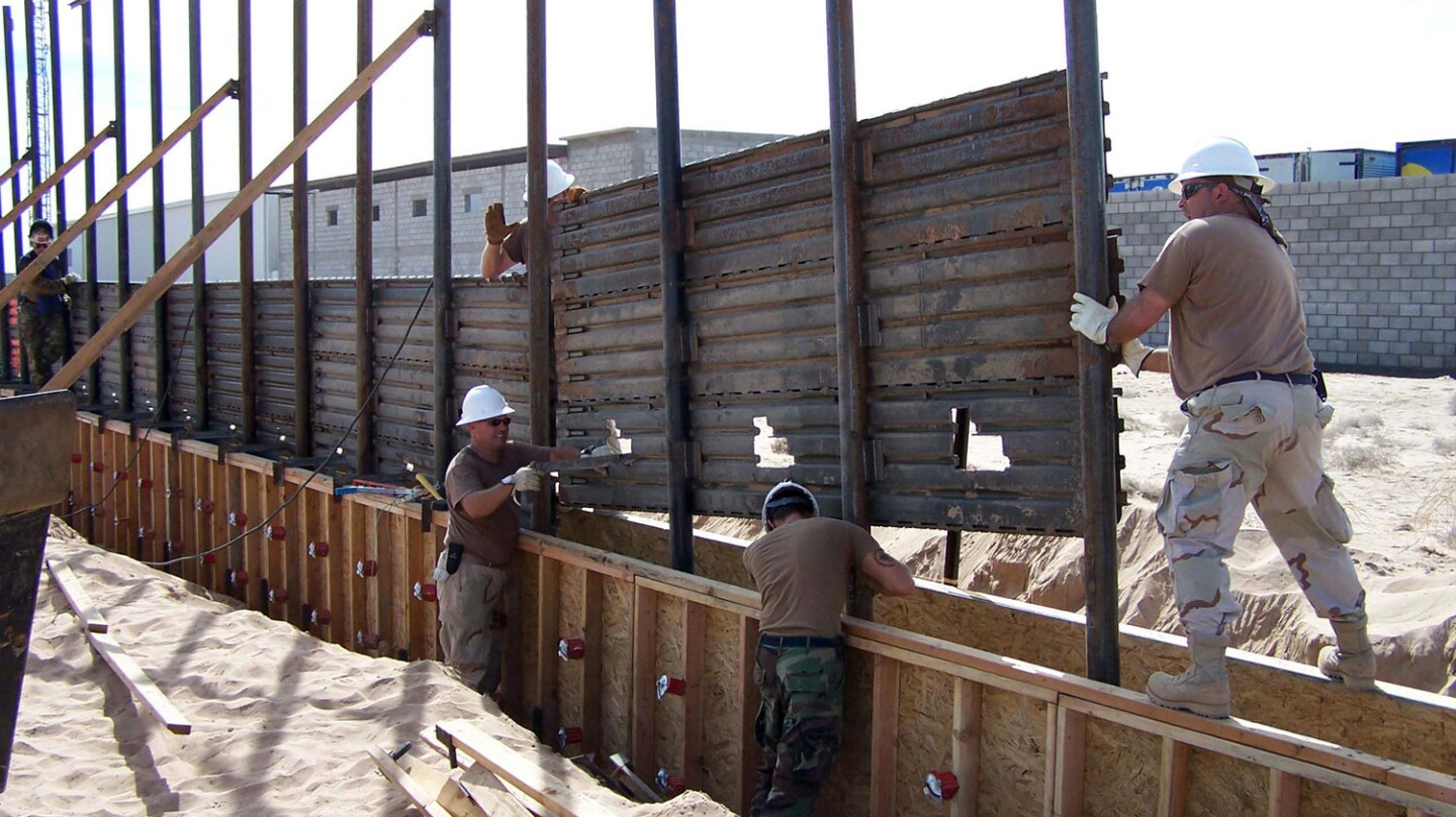 U.S. Air Force airmen install a fence along the U.S.-Mexico border east of San Luis, Ariz., on Oct. 3, 2006. Photo by Dan Heaton/Dept. of Defense