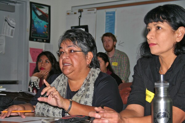 Ceci Dominguez offers advice to the students as Ruth Gallardo listens