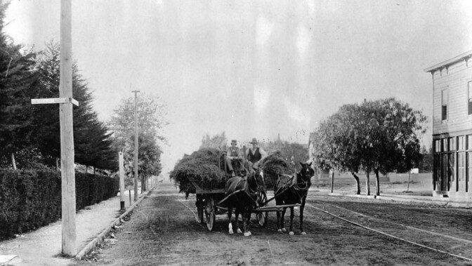 A horse-drawn wagon, seen here at Pico and Figueroa circa 1890, transports hay from the countryside into the city. Courtesy of the Security-Pacific National Bank Collection - Los Angeles Public Library.