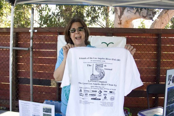 Sandra Caravella holds up one of the earliest LA River clean-up shirts she has.