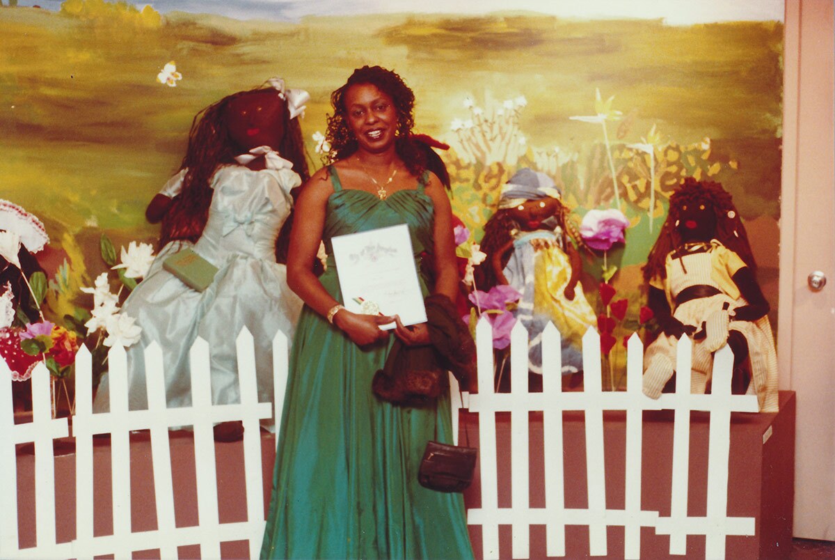 Artist Teresa Tolliver and her installation at a William Grant Still Art Center Black Doll Show, circa 87-90 | Bobbie Campbell, Courtesy of William Grant Still Art Center