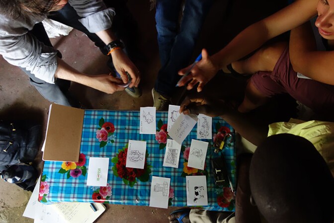 A team from IDEO.org maps financial decisions with a farmer in rural Kenya. | Danny Alexander, IDEO.org