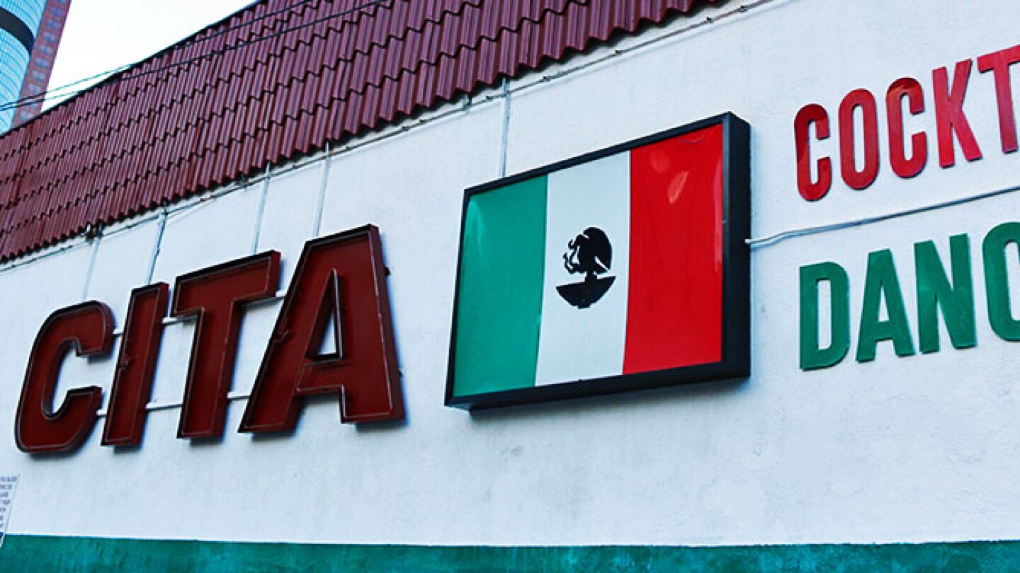 La Cita Sign with LA skyscraper in the back: Mexican flag, ":Cocktails," "Dancing" | Samanta Helou